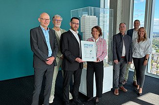 Photo of seven people from STRABAG PFS, gefma, CA Immo