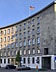 STRABAG PFS manages multiple locations for the Federal Agency for Public Safety Digital Radio (BDBOS), which is based in Berlin. Photo of a curved building with a German flag on its roof