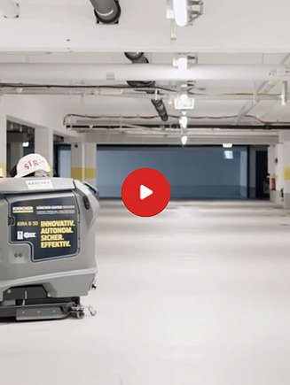Vorschaubild eines Videos: ein Reinigungsroboter steht in einer beleuchteten Tiefgarage