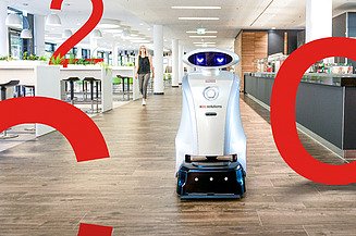 Foto von einem Reinigungsroboter auf einem langen Flur, daneben sind große rote Zeichen C, O, 2