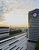 Vodafone Campus in Düsseldorf Photo of a building with Vodafone logo, in front of a sunset with clouds