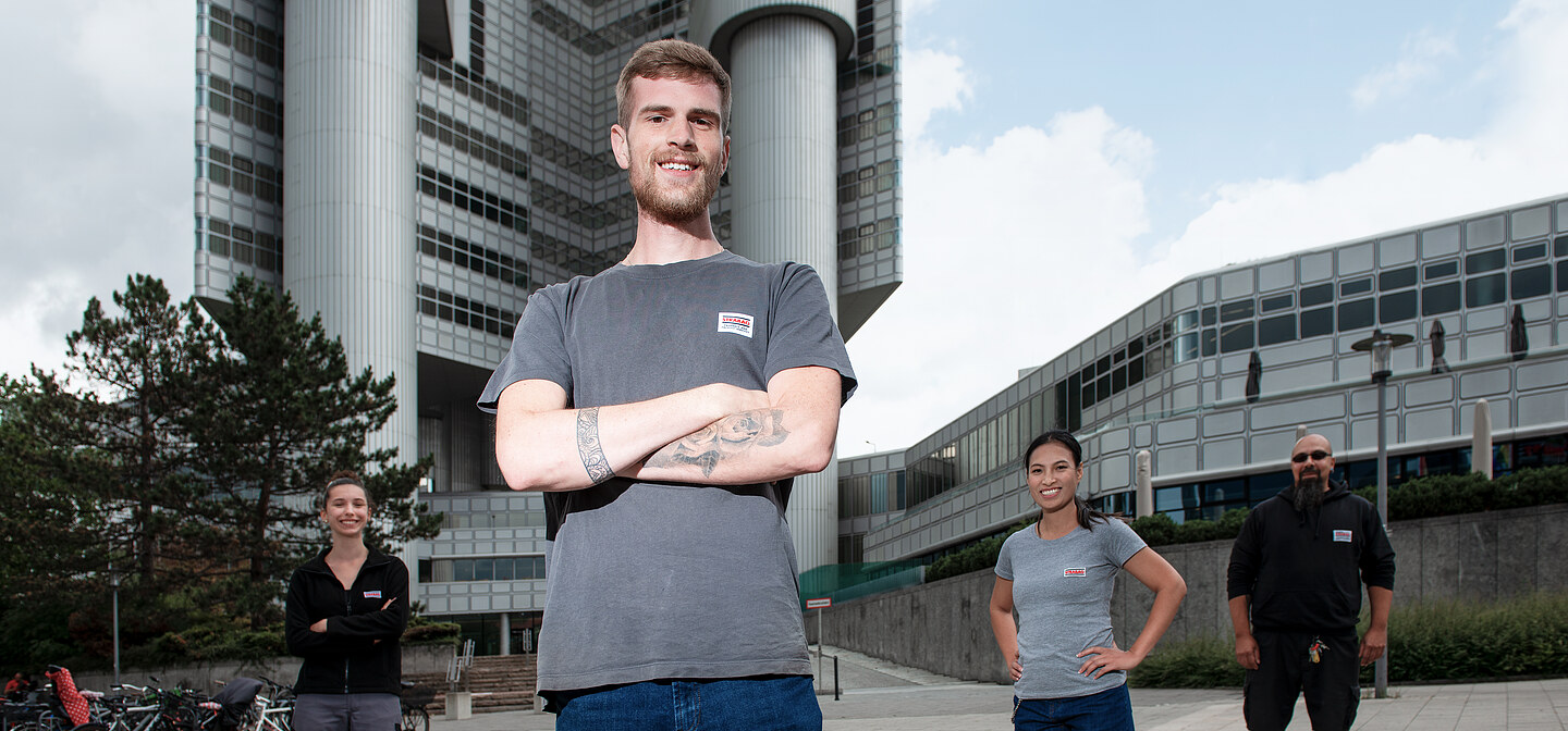 Service staff in front of a technical building system
