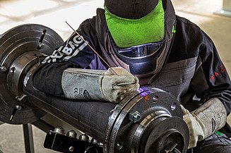 Industrial Facility Service Image of a person performing industrial facility services in the form of welding work