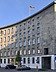 STRABAG PFS manages multiple locations for the Federal Agency for Public Safety Digital Radio (BDBOS), which is based in Berlin. Photo of a curved building with a German flag on its roof