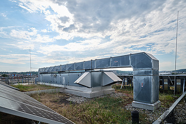 Picture of the repair of a heating system by two employees