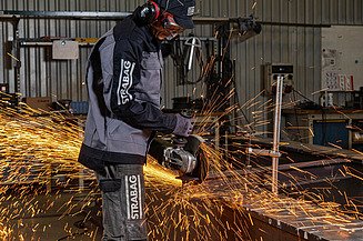 Steel construction Picture of a person cutting steel with an angle grinder