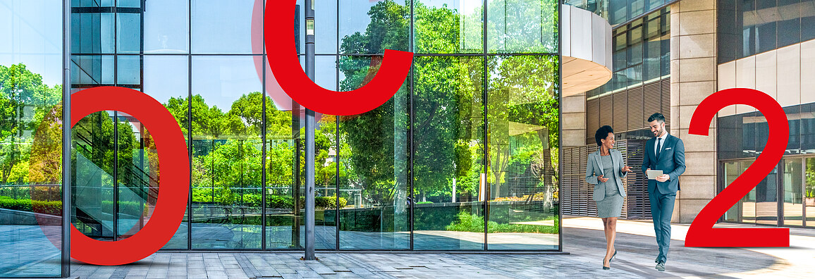 eco2solutions Image of large red letters O, C and 2 in front of a glass façade