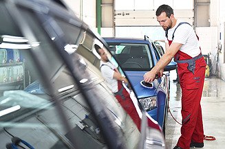 Car preparation Picture of a man polishing a car