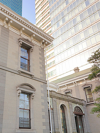 Picture of an older building next to a modern glass building